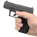 GX4 Magazine Extender in Pistol XTech GX4 grip extension installed and showing additional grip provided holding the GX4 pistol