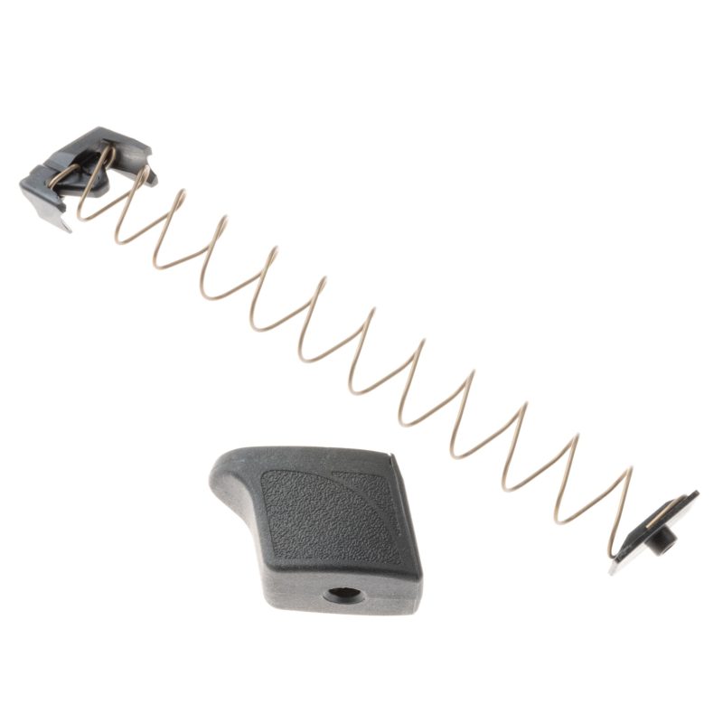 M&P 9 magazine extension kit shown with extension and spring. Extension in black and spring facing left