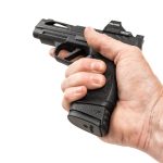 P365xl 17 round magazine adaptor in hand P365xl magazine sleeve fills gap perfectly in pistol shown