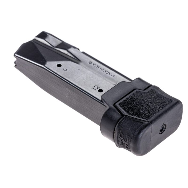 Sig Sauer P365 magazine with XTech Tactical MTX +3 installed into magazine facing rate and rotated slightly to the left. Showing base plate and spring button to disassemble for cleaning