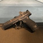 Walther PDP Compact on Range Walther PDP Compact with 18round magazine and sleeve at range on table facing left
