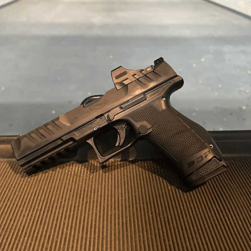 Walther PDP Compact with 18round magazine and sleeve at range on table facing left